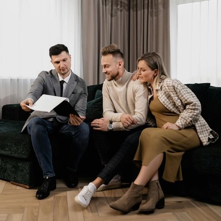 A couple meeting with their attorney