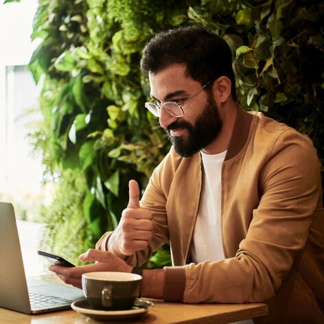 A man using his computer for a virtual consultation.